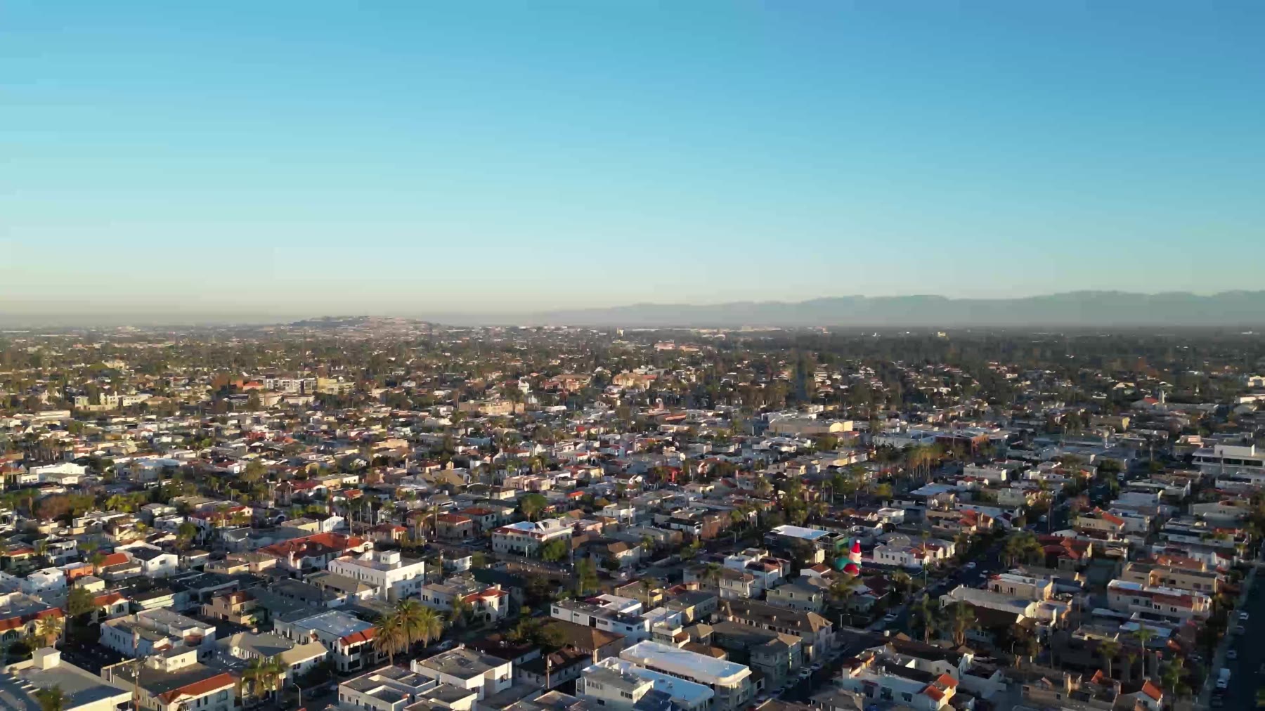 Aerial view over Long Beach area coastal neighborhoods at golden hour